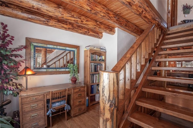 office space with beam ceiling, wood ceiling, and wood finished floors