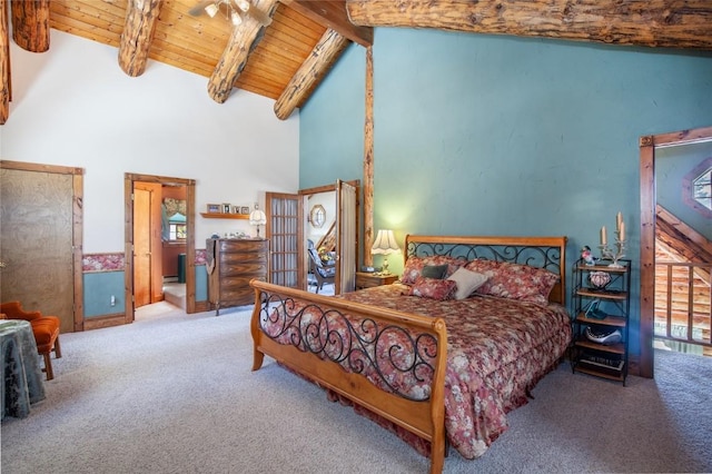 bedroom with multiple windows, beam ceiling, carpet, and wood ceiling