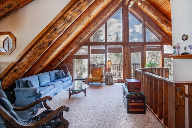 carpeted living room featuring vaulted ceiling with beams and wooden ceiling