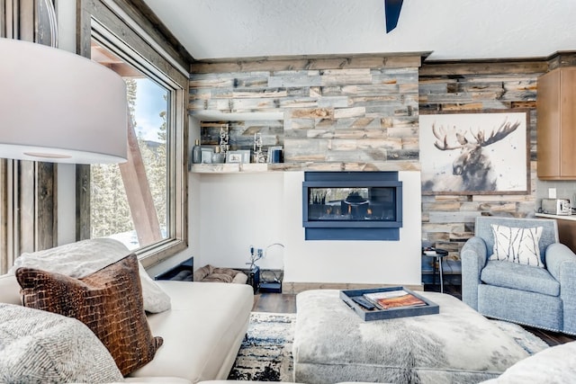 living room featuring wood-type flooring and a textured ceiling