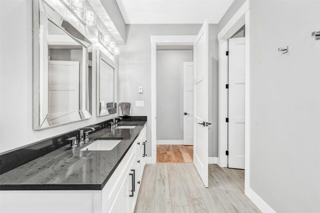 bathroom featuring hardwood / wood-style floors and vanity