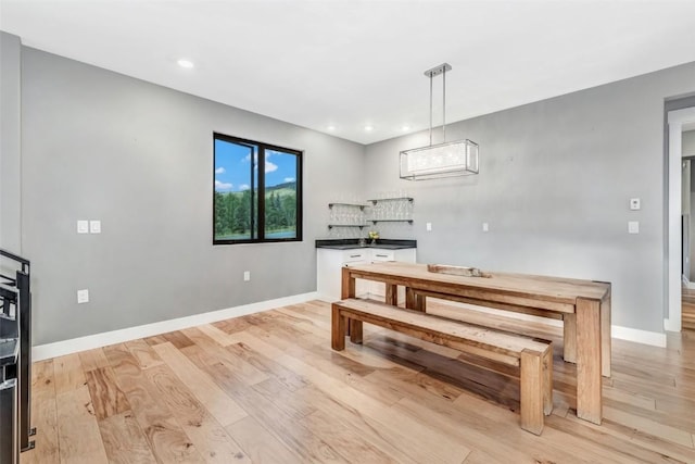 dining area with light hardwood / wood-style flooring