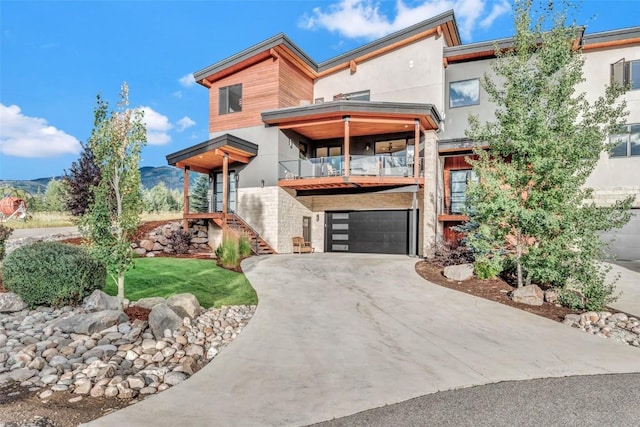 modern home featuring a mountain view and a garage