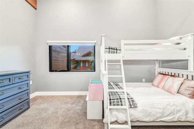 bedroom with light colored carpet