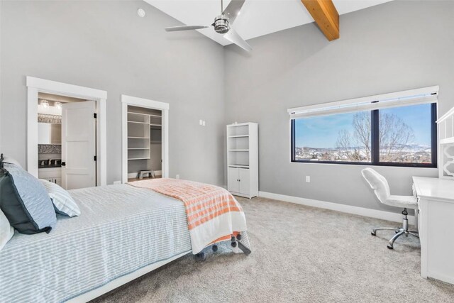 carpeted bedroom with ceiling fan and lofted ceiling