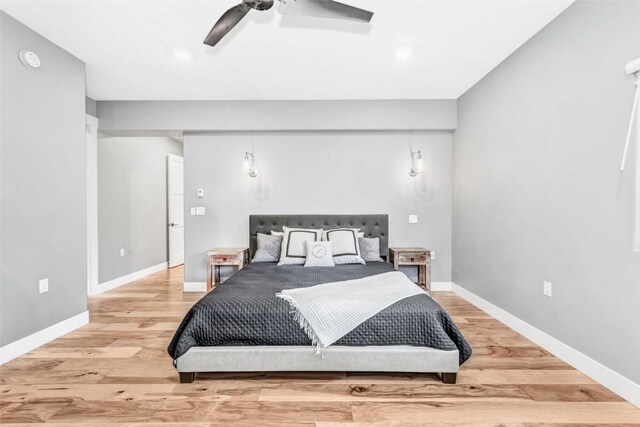 bedroom featuring hardwood / wood-style flooring and ceiling fan