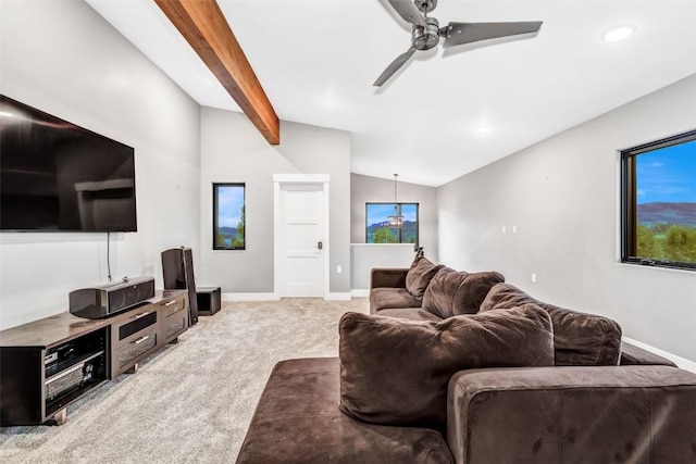 carpeted living room featuring lofted ceiling with beams and ceiling fan