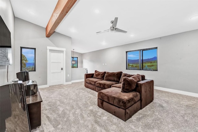 carpeted living room with lofted ceiling with beams and ceiling fan