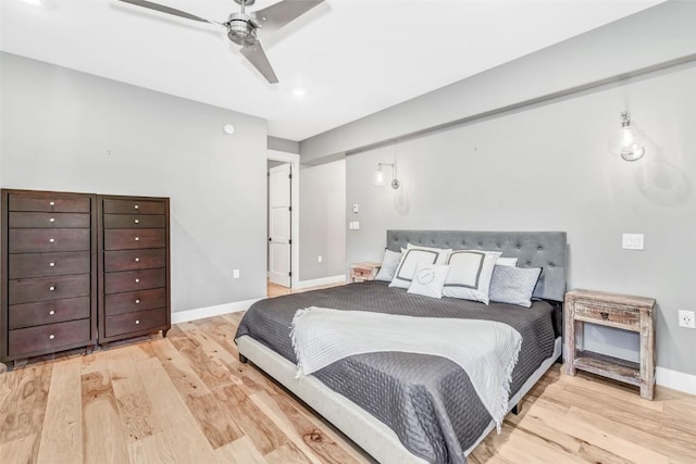 bedroom with ceiling fan and light wood-type flooring