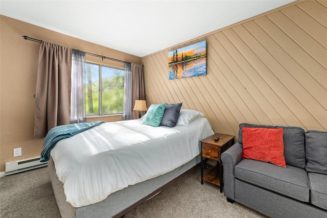 carpeted bedroom with wood walls and a baseboard radiator