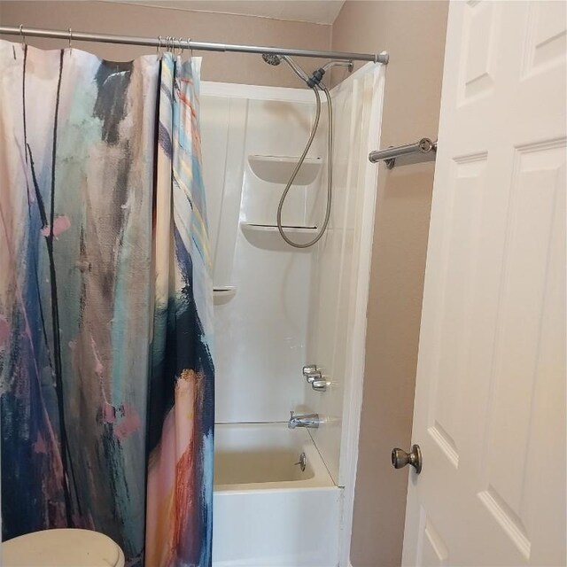 bathroom featuring shower / tub combo with curtain