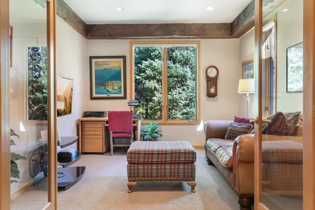 sitting room with light colored carpet and french doors