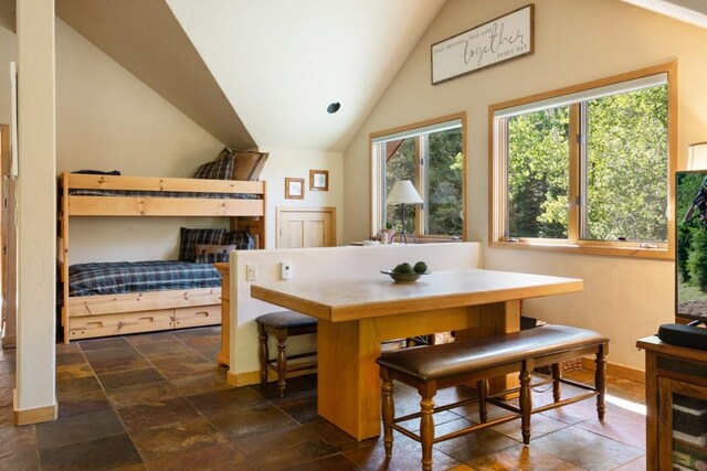 dining space featuring lofted ceiling