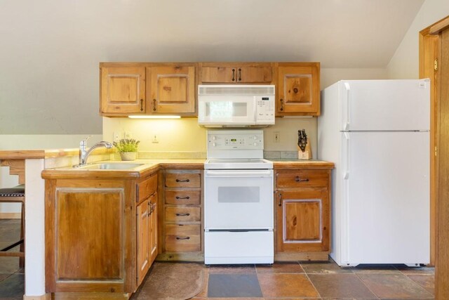 kitchen with sink and white appliances