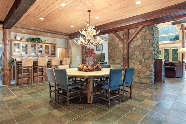 dining area featuring beam ceiling, wood ceiling, and a notable chandelier