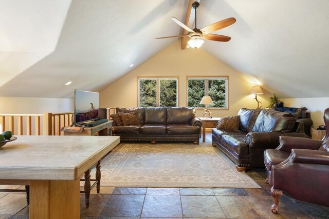 living room featuring ceiling fan and lofted ceiling