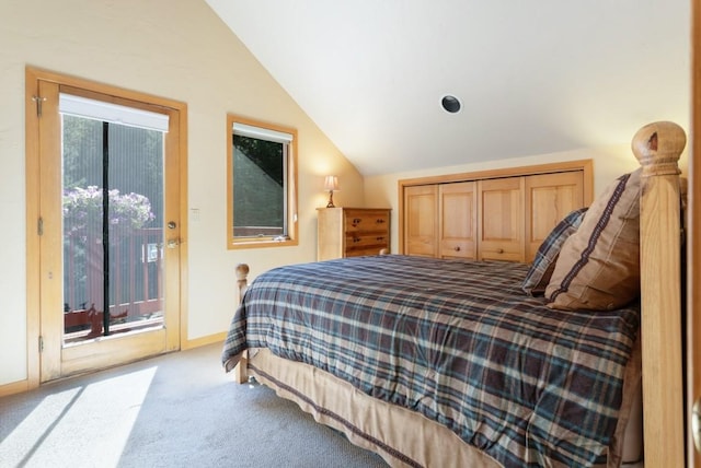 bedroom featuring access to exterior, light colored carpet, vaulted ceiling, and a closet