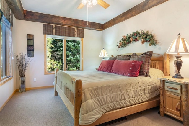 bedroom featuring multiple windows, light colored carpet, and ceiling fan