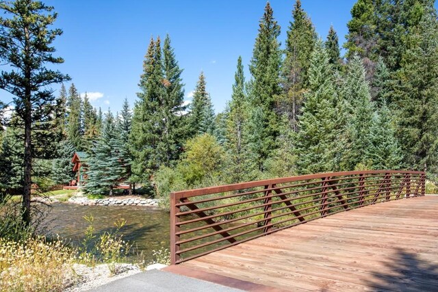 wooden terrace with a water view