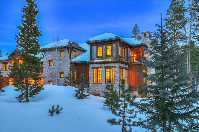 view of snow covered house