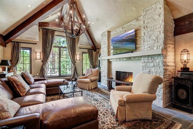 living room featuring a fireplace, beamed ceiling, a chandelier, and high vaulted ceiling