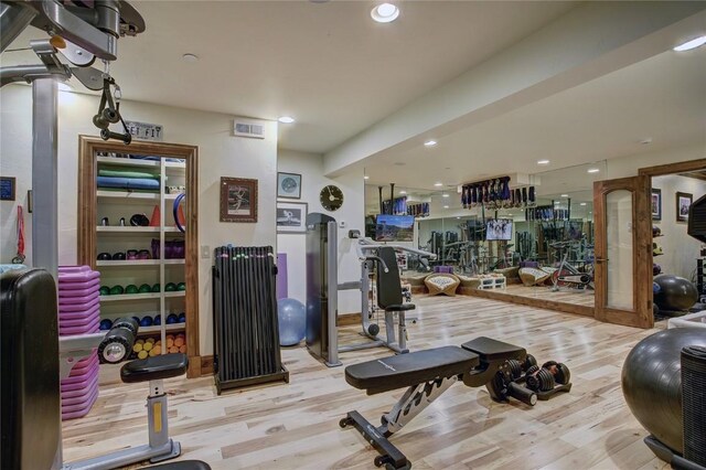 workout area featuring light hardwood / wood-style flooring