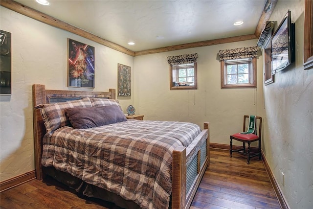 bedroom featuring dark hardwood / wood-style flooring