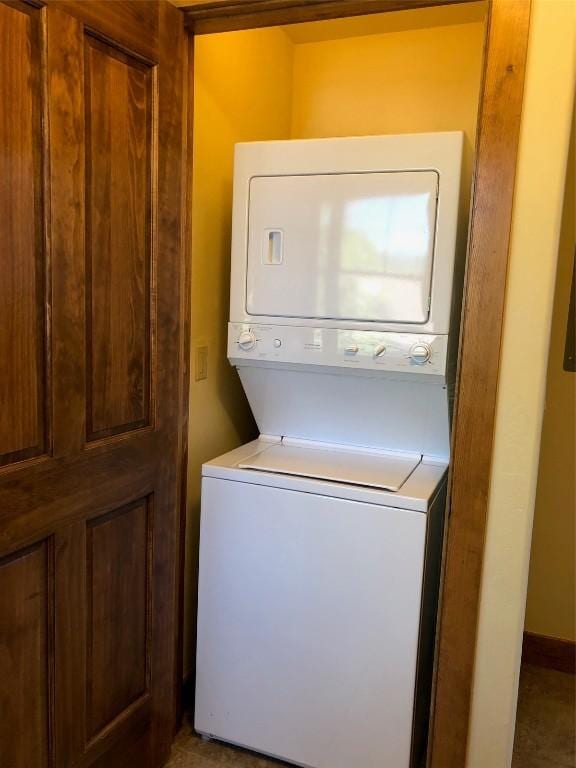 laundry area featuring laundry area and stacked washing maching and dryer