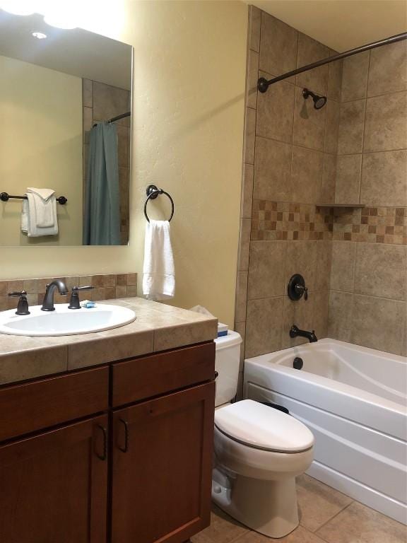 full bath featuring vanity, shower / bath combination with curtain, toilet, and tile patterned floors