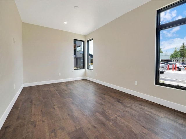 unfurnished room featuring dark hardwood / wood-style flooring