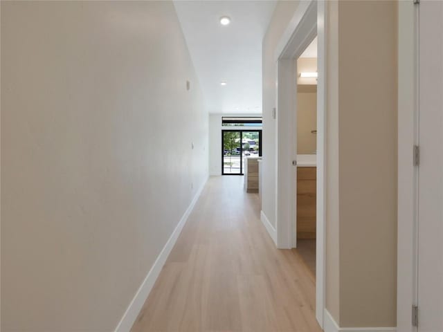 corridor featuring light hardwood / wood-style flooring