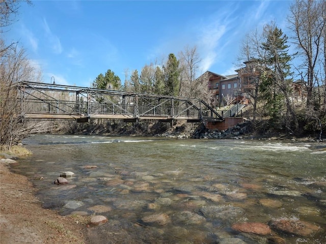 view of home's community with a water view