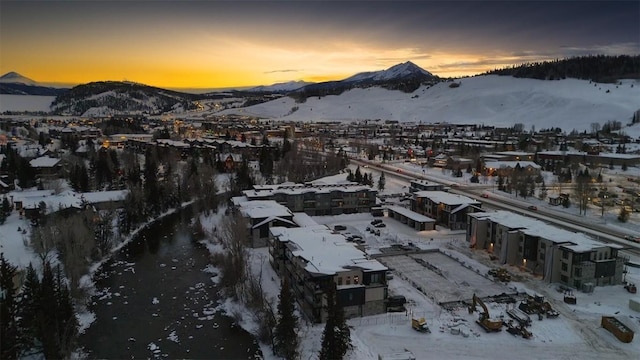 snowy aerial view with a mountain view