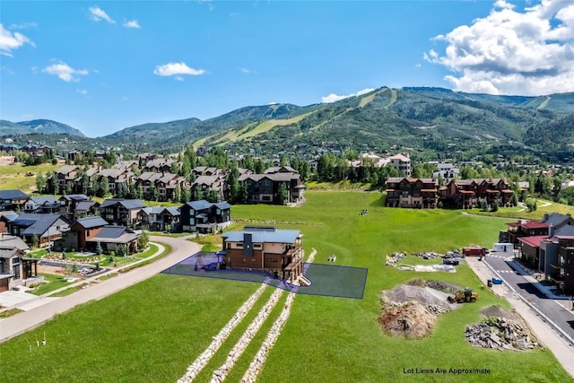 birds eye view of property with a mountain view