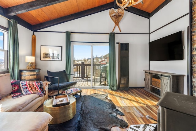 living room featuring wooden ceiling, lofted ceiling with beams, and wood finished floors