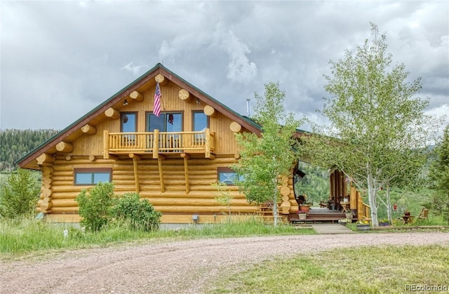 log-style house with a balcony