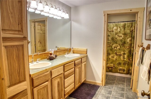 bathroom with curtained shower and vanity