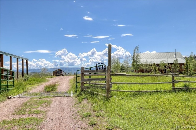 view of gate featuring a mountain view and a rural view