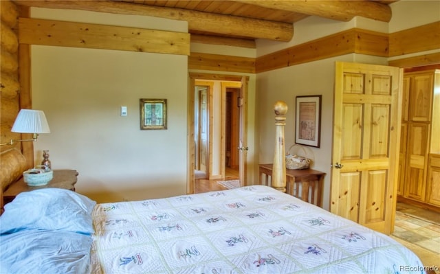 bedroom featuring beam ceiling and wood ceiling