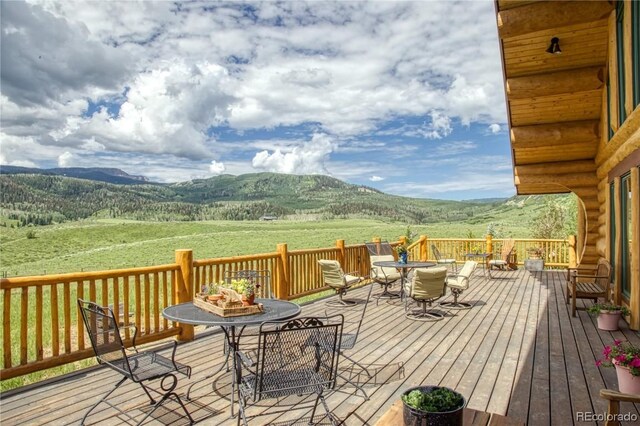 wooden deck featuring a mountain view