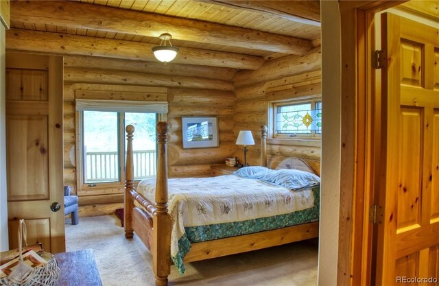 bedroom with carpet, beam ceiling, wood ceiling, and log walls