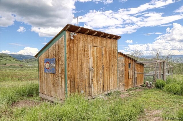 view of outbuilding with a mountain view