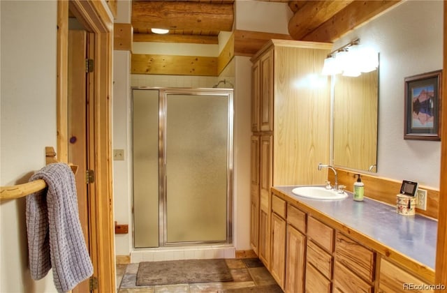 bathroom featuring vanity and walk in shower