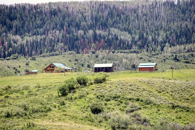 property view of mountains featuring a rural view