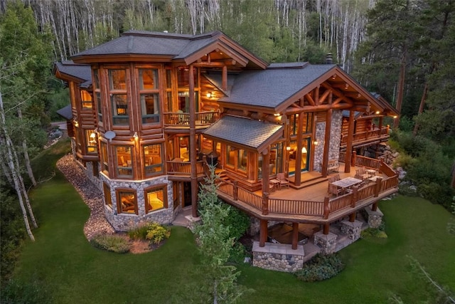 exterior space featuring a wooden deck and a yard