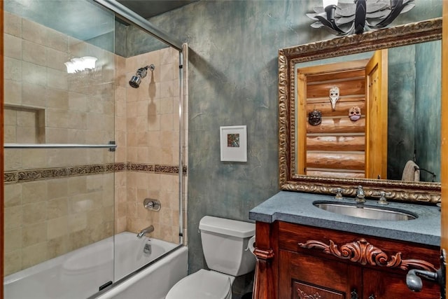 full bathroom with vanity, shower / bath combination with glass door, and toilet