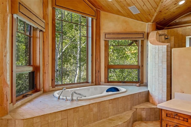 bathroom featuring lofted ceiling, tiled bath, and wood ceiling