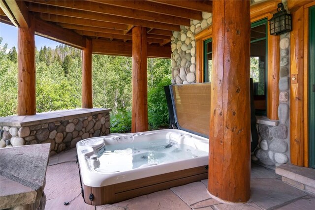 view of patio featuring an outdoor hot tub