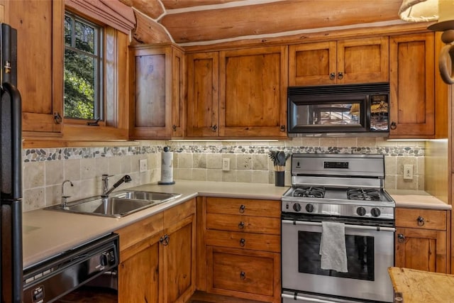 kitchen featuring sink, decorative backsplash, and black appliances