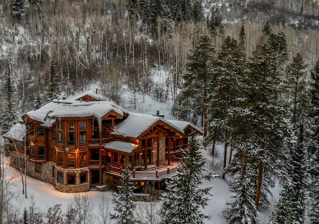 view of snow covered house